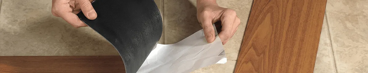 A professional installing vinyl flooring in Houston, TX